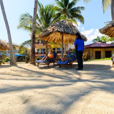 Server on beach with drinks