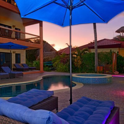 Pool umbrella at sunset