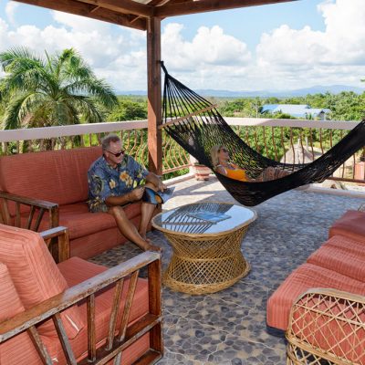 Reading a book on Belize rooftop