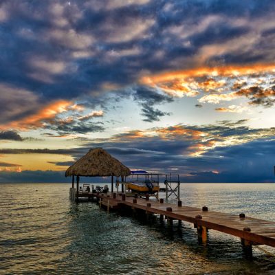 Palapa and dock at sunset