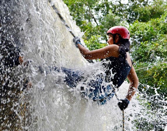 Belize waterfall rappelling