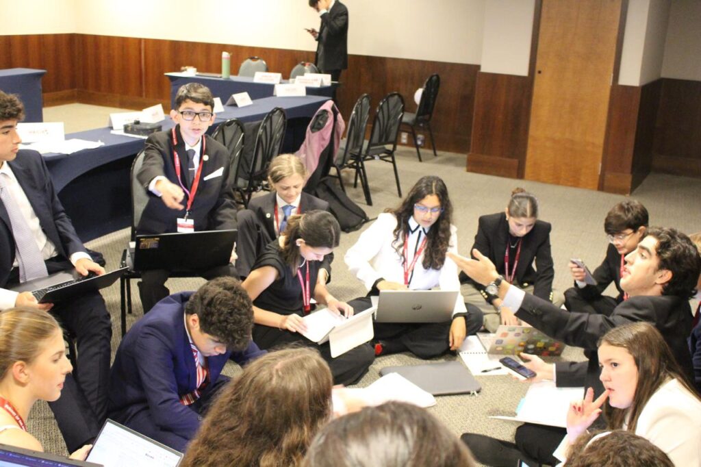 Committee seated on floor
