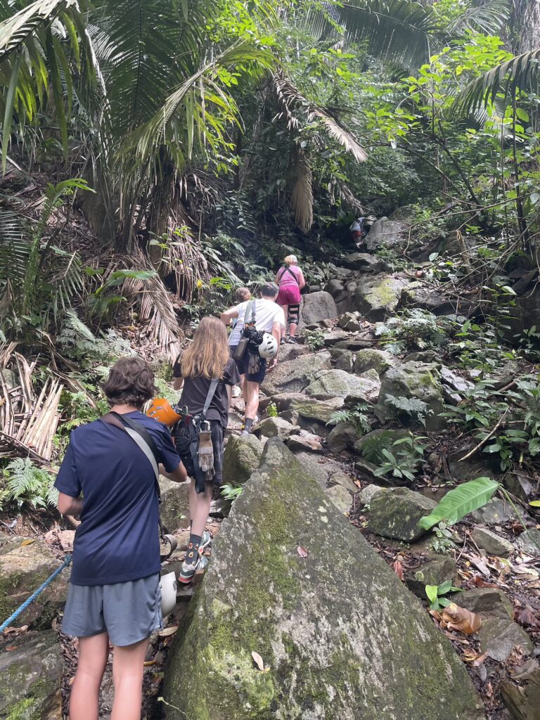 Group hiking with rope