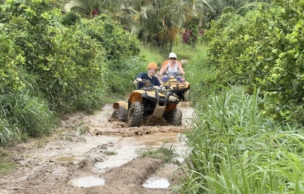 Me on an ATV in a huge mud puddle