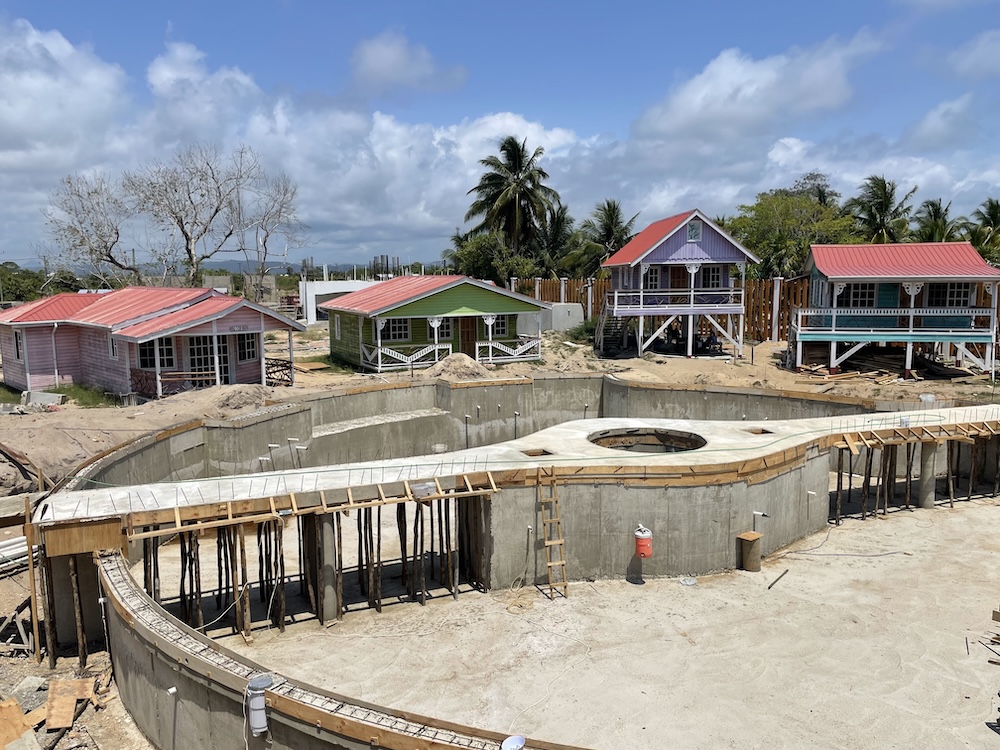 The pool has a concrete bridge across the center