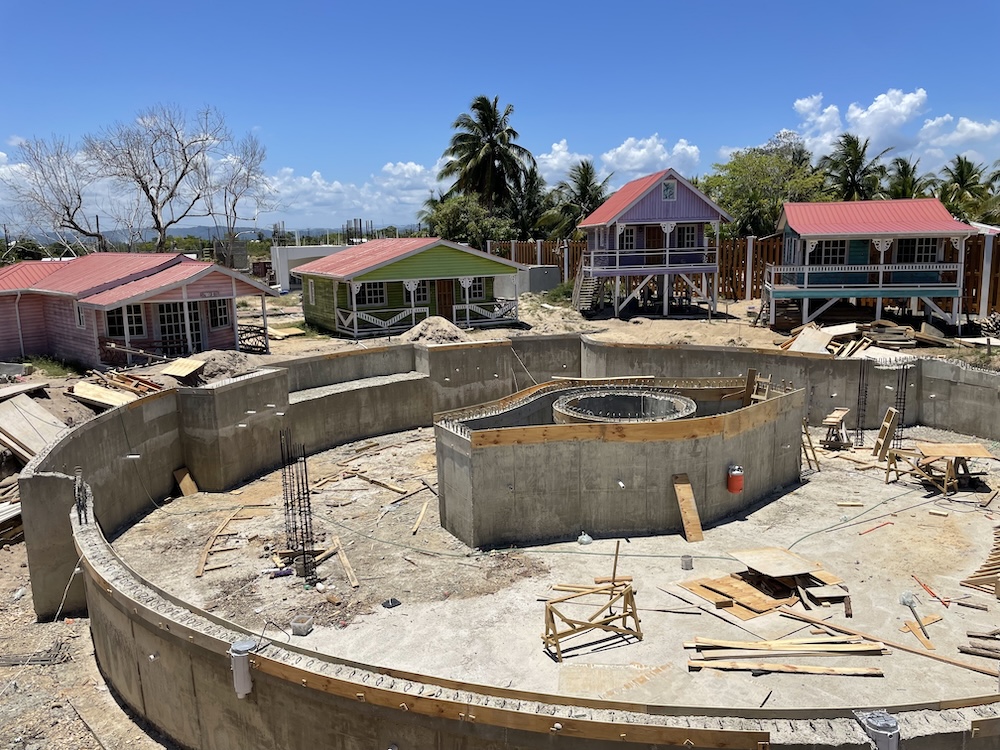 Wooden forms have been removed showing concrete pool walls